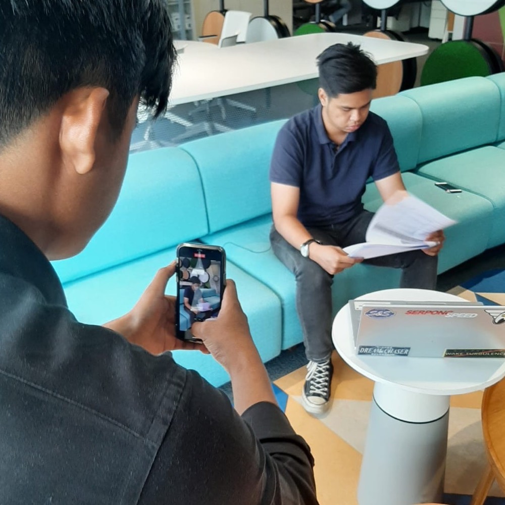 Filming behind the scenes during a client shoot