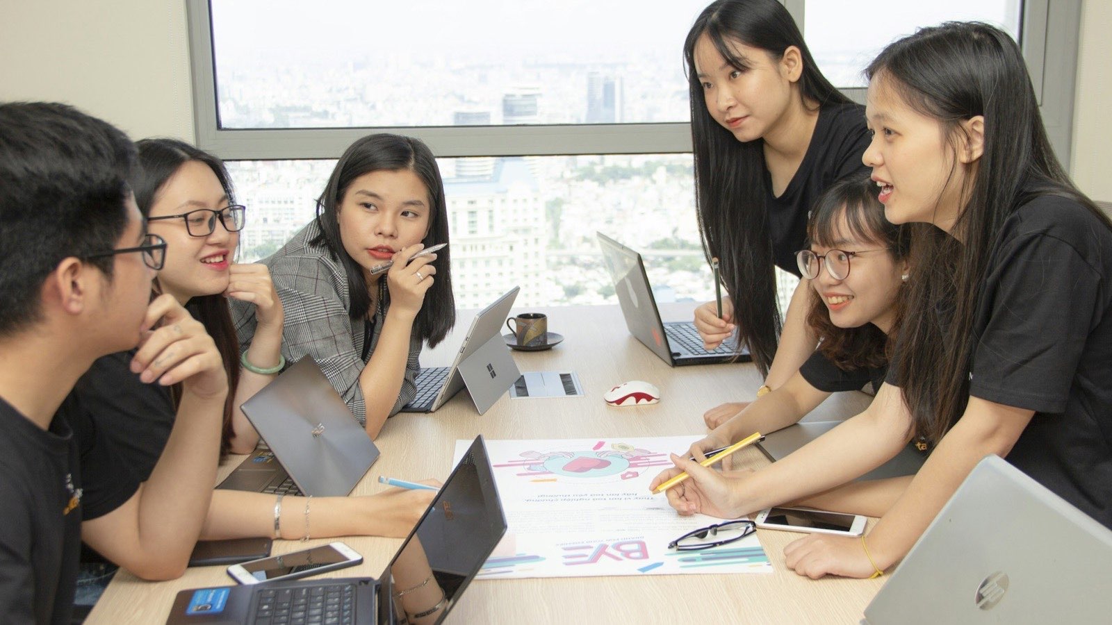 A creative team working through ideas together around a table